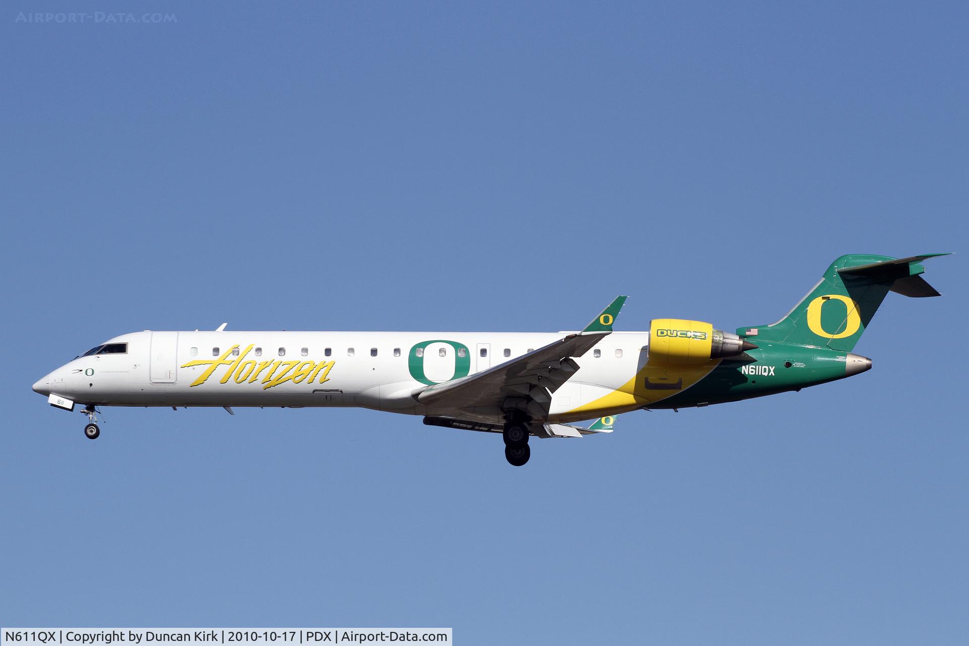 N611QX, Bombardier CRJ-701 (CL-600-2C10) Regional Jet C/N 10041, Flying the colors of the current #1 college football team in the country