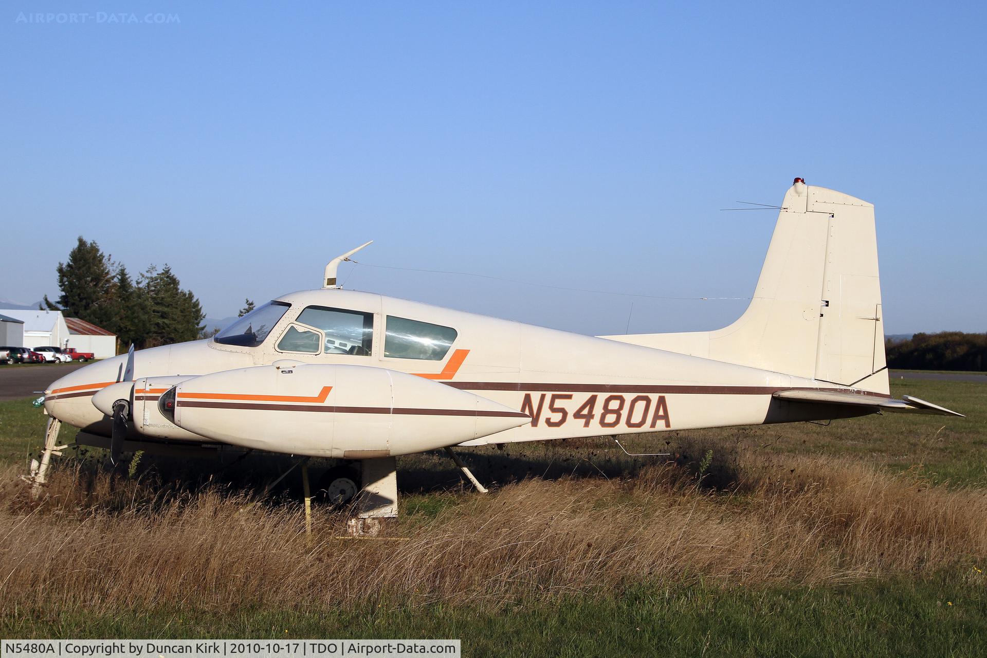 N5480A, 1958 Cessna 310B C/N 35680, The grass grows long around this 1958 bird