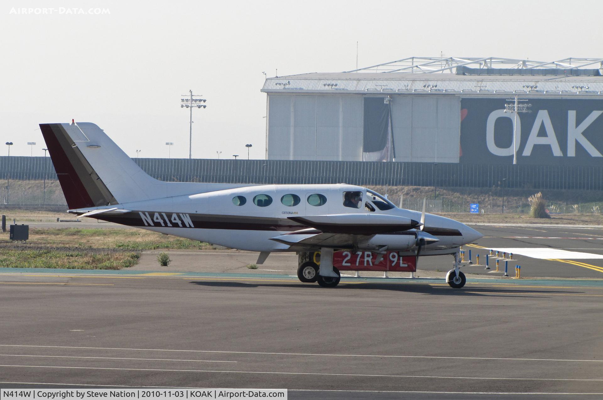 N414W, 1969 Cessna 414 Chancellor C/N 414-0025, Any guesses where this photo was taken? If you said KOAK - Oakland, CA you're right. Locally-based 1969 Cessna 414 running-up before take-off from North Field