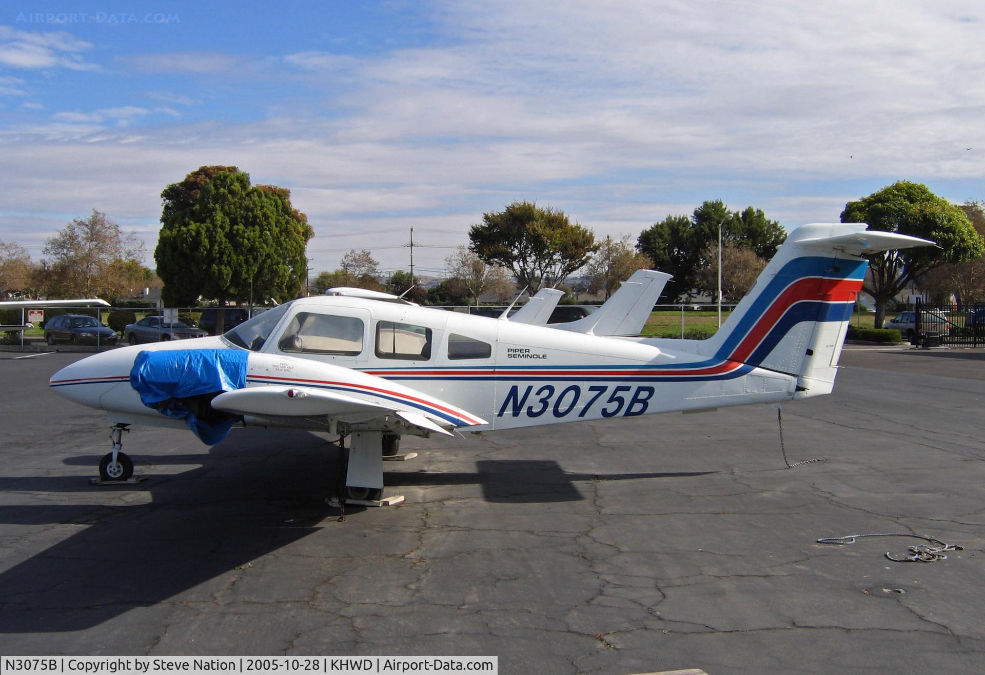 N3075B, 1978 Piper PA-44-180 Seminole C/N 44-7995115, Flying Vikings 1978 Piper PA-44-180 minus prop plus blue hefty bag @ Hayward, CA home base in Oct 2005