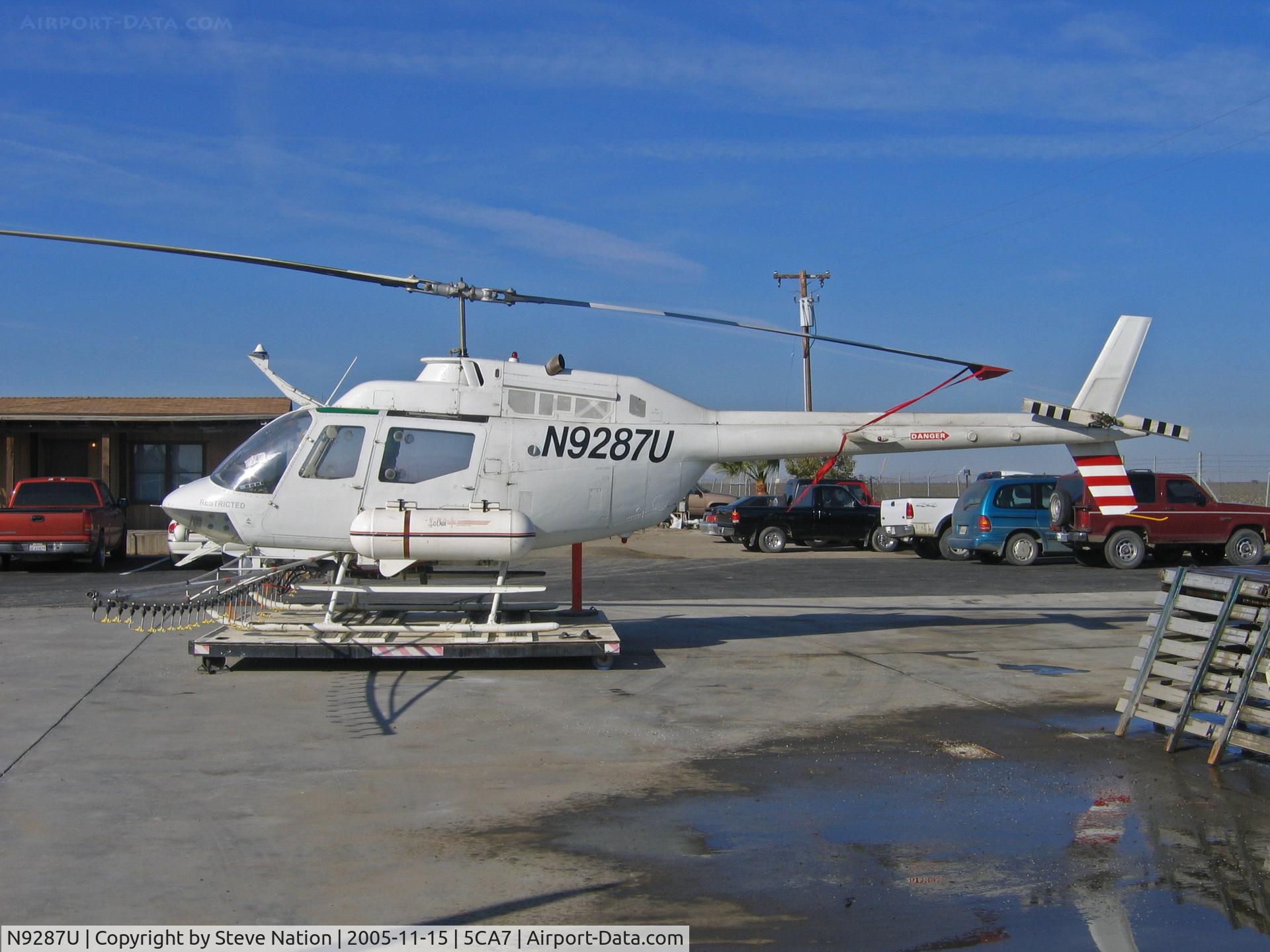 N9287U, 1971 Bell OH-58A C/N 71-20428, American West Aviation Bell OH-58A (ex 71-20428) in all white scheme rigged for spraying @ AWA airstrip NE of Five Points, CA