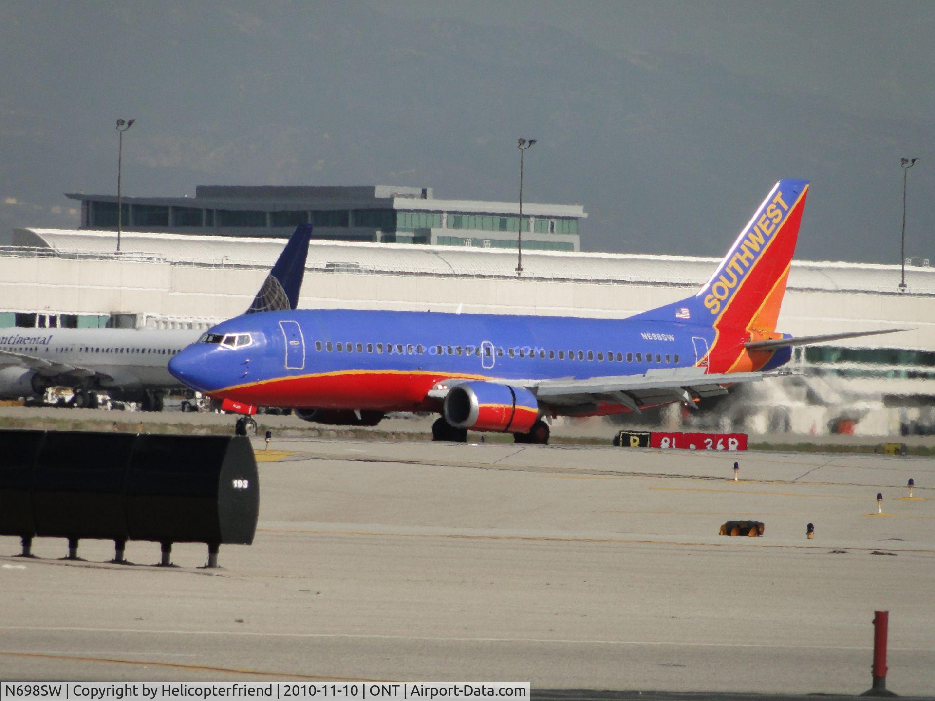 N698SW, 1986 Boeing 737-317 C/N 23176, Preparing to enter the taxiway after landing on runway 26 and is enroute to Southwest's terminal