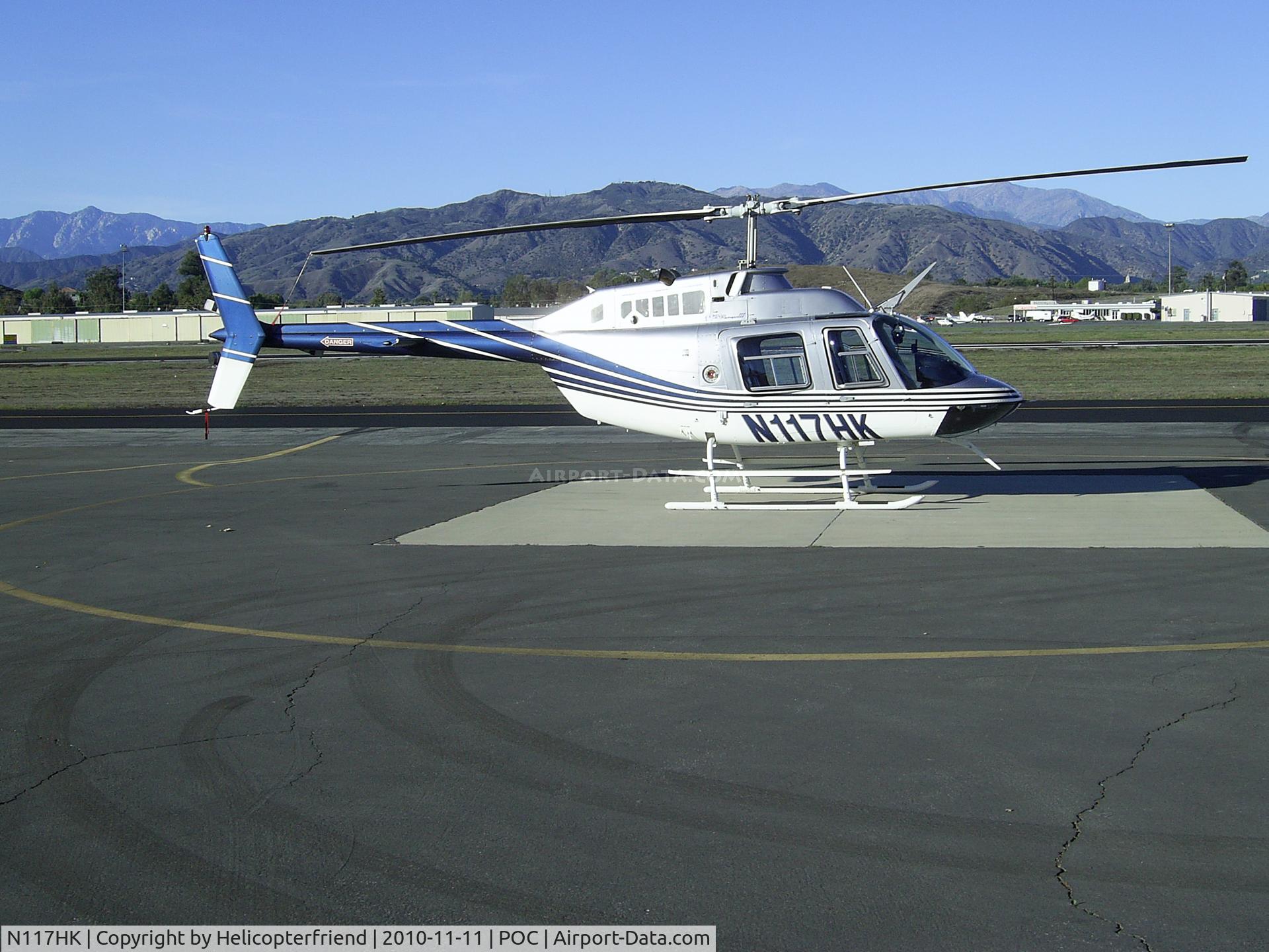 N117HK, 1997 Bell 206B JetRanger III C/N 4462, Parked at west helipad and visiting the drag races at LACO Fairplex