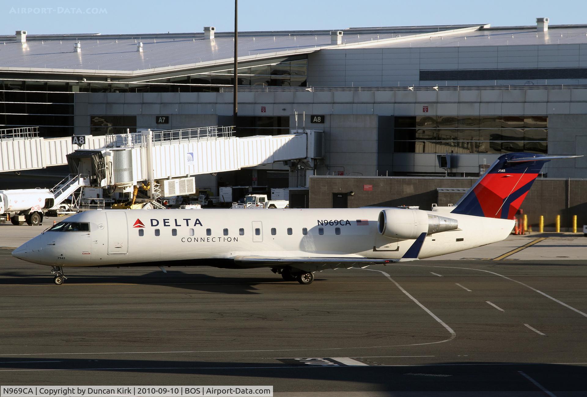 N969CA, 1996 Canadair CRJ-100ER (CL-600-2B19) C/N 7141, The shadows show the early hour! Yes I took a red eye and was changing flights