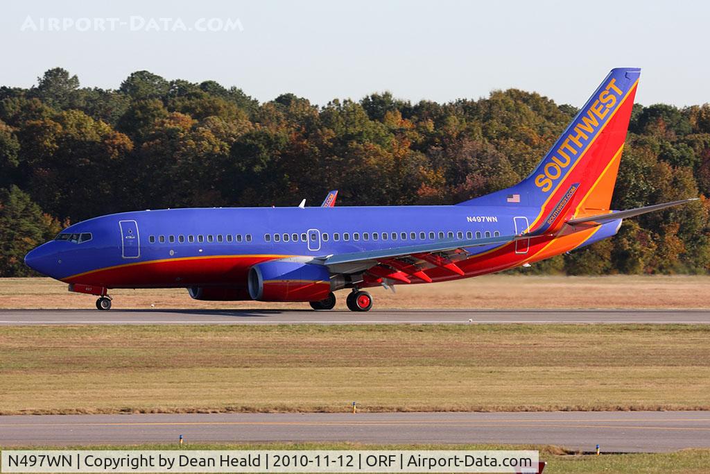 N497WN, 2004 Boeing 737-7H4 C/N 32479, Southwest Airlines N497SW (FLT SWA882) rolling out on RWY 5 after arrival from Baltimore/Washington Int'l (KBWI).