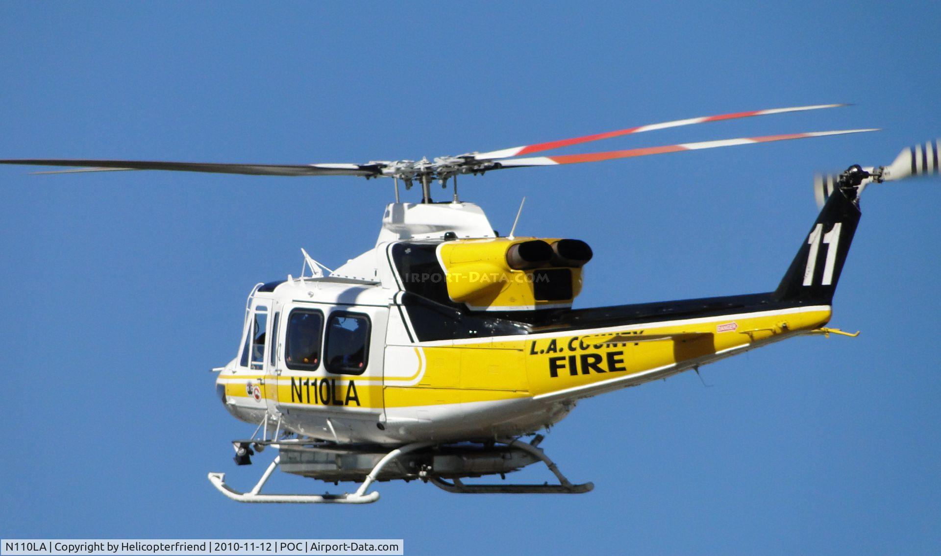 N110LA, 2005 Bell 412EP C/N 36392, headed westbound south of taxiway Sierra, enroute to helipad