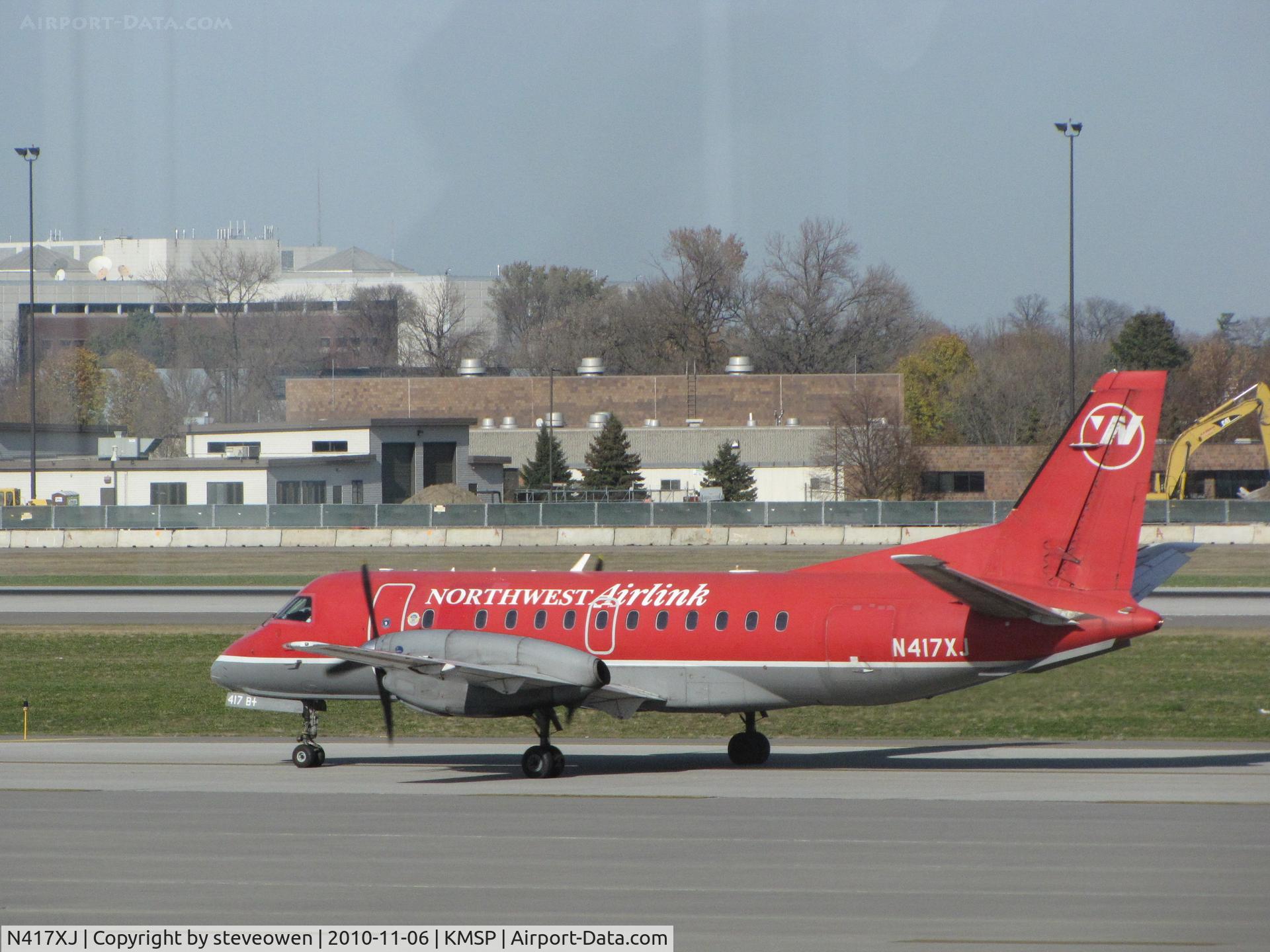 N417XJ, Saab 340B C/N 340B417, Still in NorthWest Airlink colours 6/nov/2010 after the Delta take over.Taken from inside the terminal at MSP
