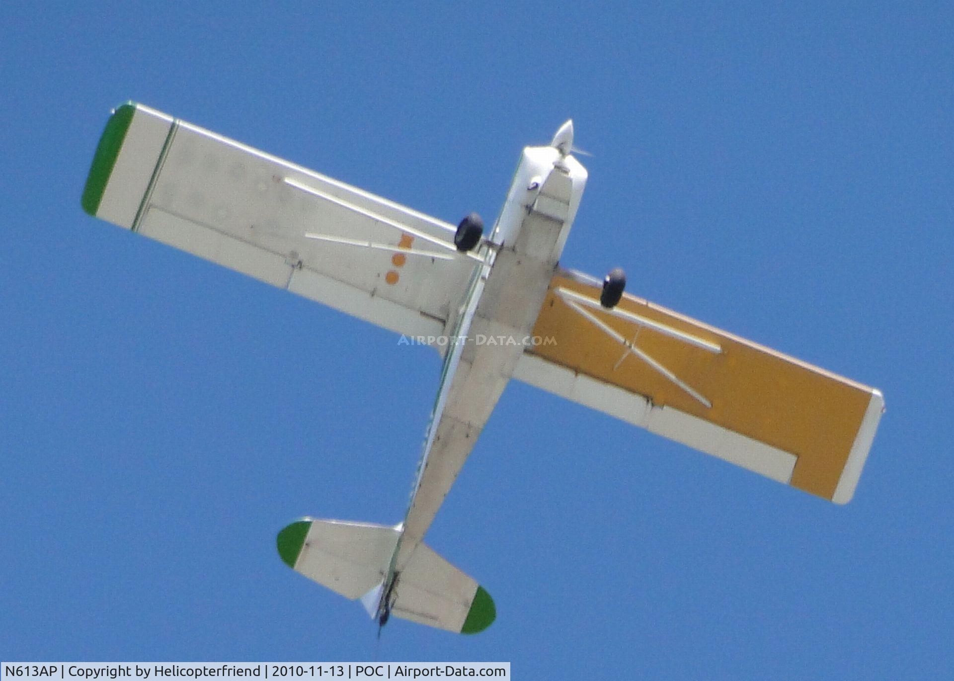 N613AP, 1976 Bellanca 8GCBC C/N 190-76, Pulling a banner advertisement around the drag races and crossing over Brackett (POC) Field and passing directly over photographer