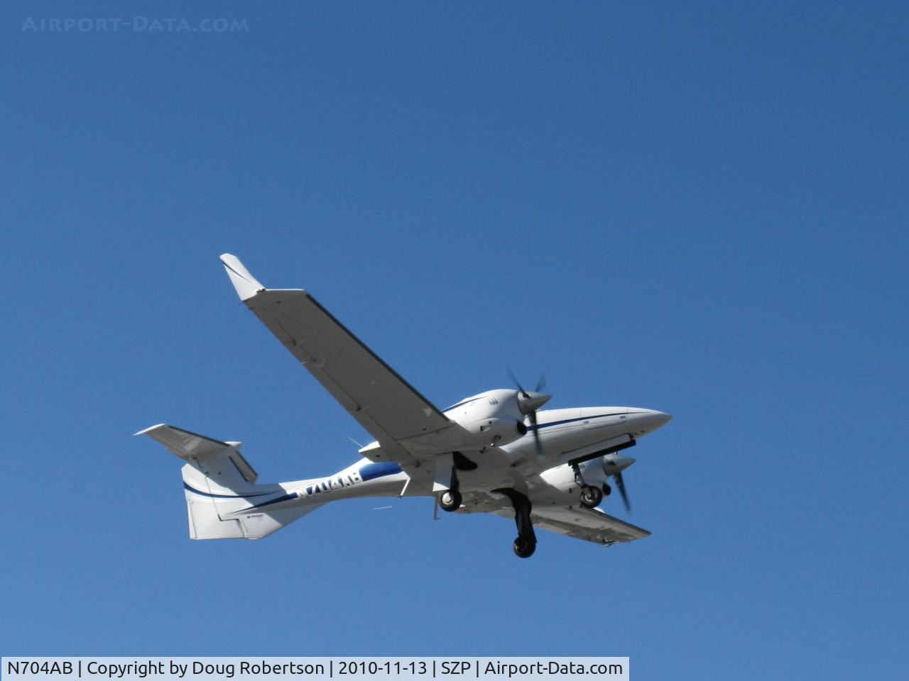 N704AB, 2006 Diamond DA-42 Twin Star C/N 42.091, 2006 Diamond Aircraft Ind. Gmbh DIAMOND DA-42D TWIN STAR, two Thielert Centurion TAE-125-01 1.7 turbo-charged 135 hp each Diesels, takeoff climb Rwy 04