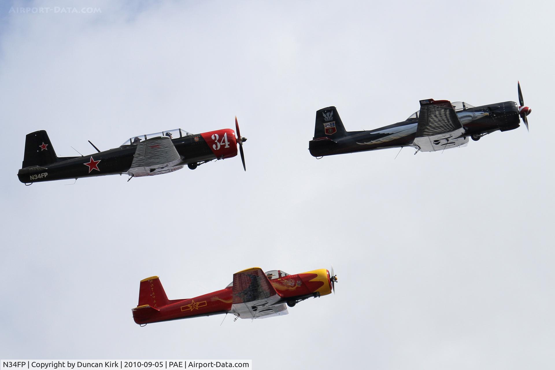 N34FP, 1965 Nanchang CJ-6A C/N 1332013, Three Nanchangs were joined by six others doing flybys at PAE for this major historical aircraft event