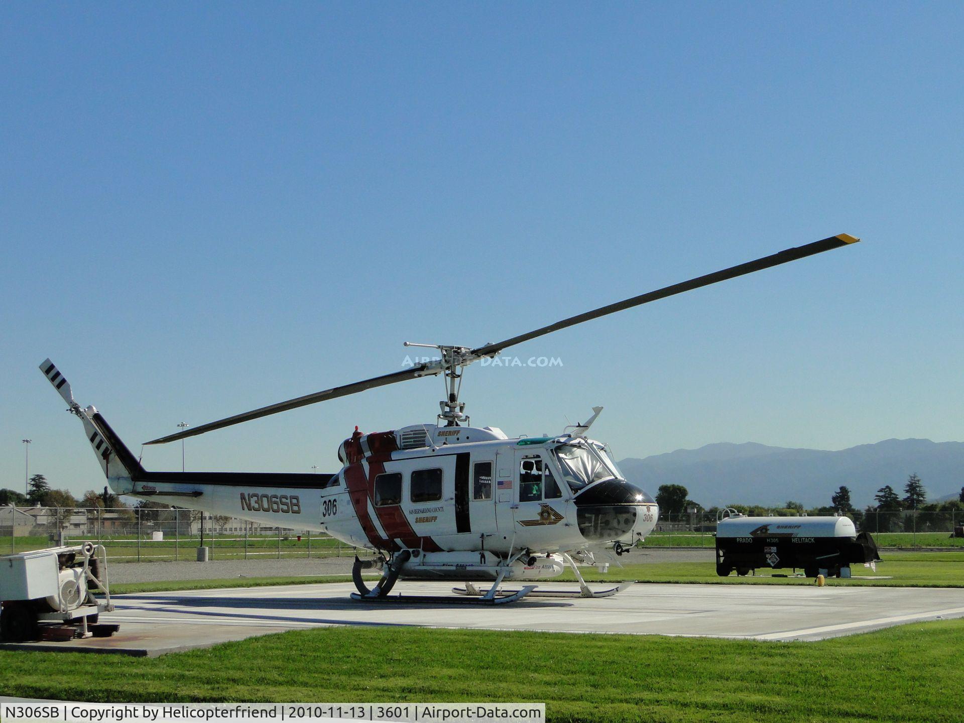 N306SB, 1971 Bell UH-1H Iroquois C/N 13041, Parked at Prado Helitack Base west of Chino (CNO) and is standing by for N305SB which is having it's 100 hr maintainece perfrormed. Base not listed but is close to CNO