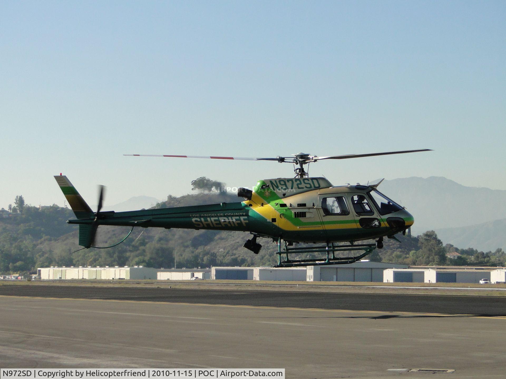 N972SD, 2003 Eurocopter AS-350B-2 Ecureuil Ecureuil C/N 3771, Air Taxiing behind N950DG towards runway 26L