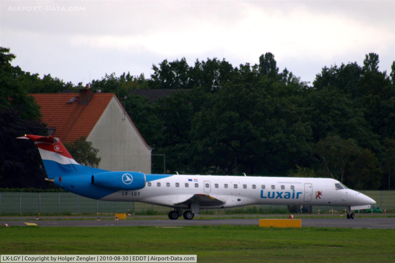 LX-LGY, 2000 Embraer EMB-145LU (ERJ-145LU) C/N 145242, Waiting for all-clear on rwy 26L.