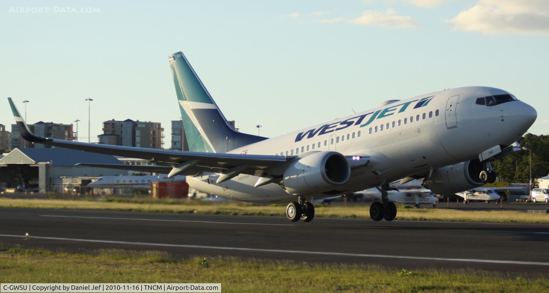 C-GWSU, 2009 Boeing 737-7CT C/N 36689, WestJet C-GWSU taking off at TNCM runway 10