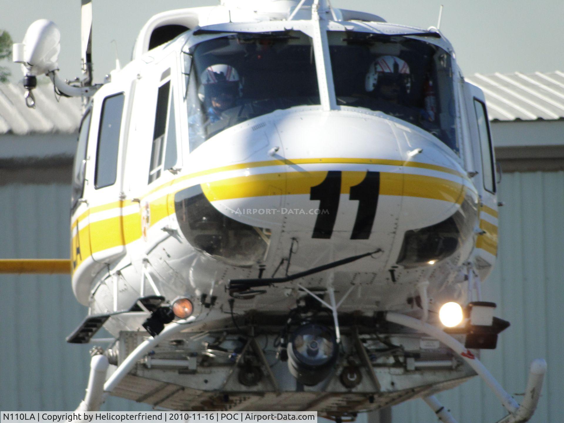 N110LA, 2005 Bell 412EP C/N 36392, Both appear to be checking out photographer before turning left and landing on pad