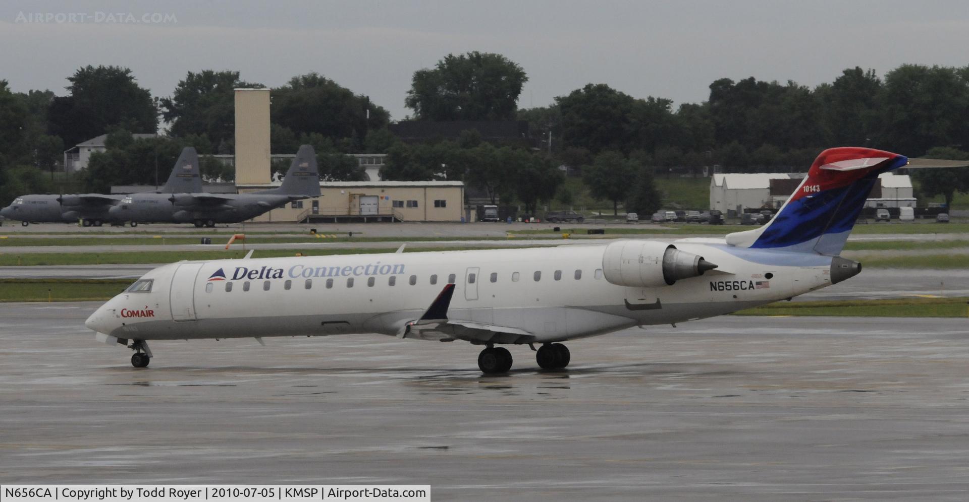 N656CA, 2004 Bombardier CRJ-700 (CL-600-2C10) Regional Jet C/N 10143, Stormy day at MSP