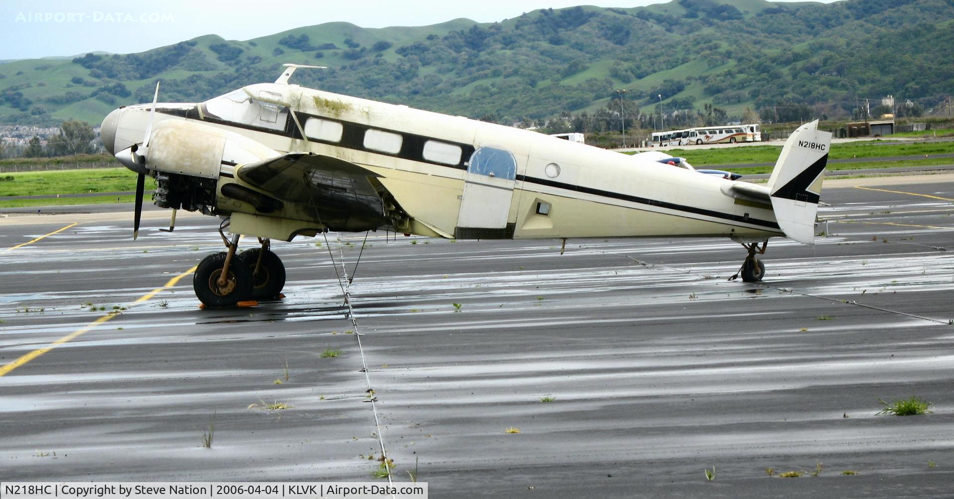 N218HC, 1944 Beech C18S C/N 8281, Derelict 1944 Beech C18S, minus rudders @ Livermore, CA after the rain