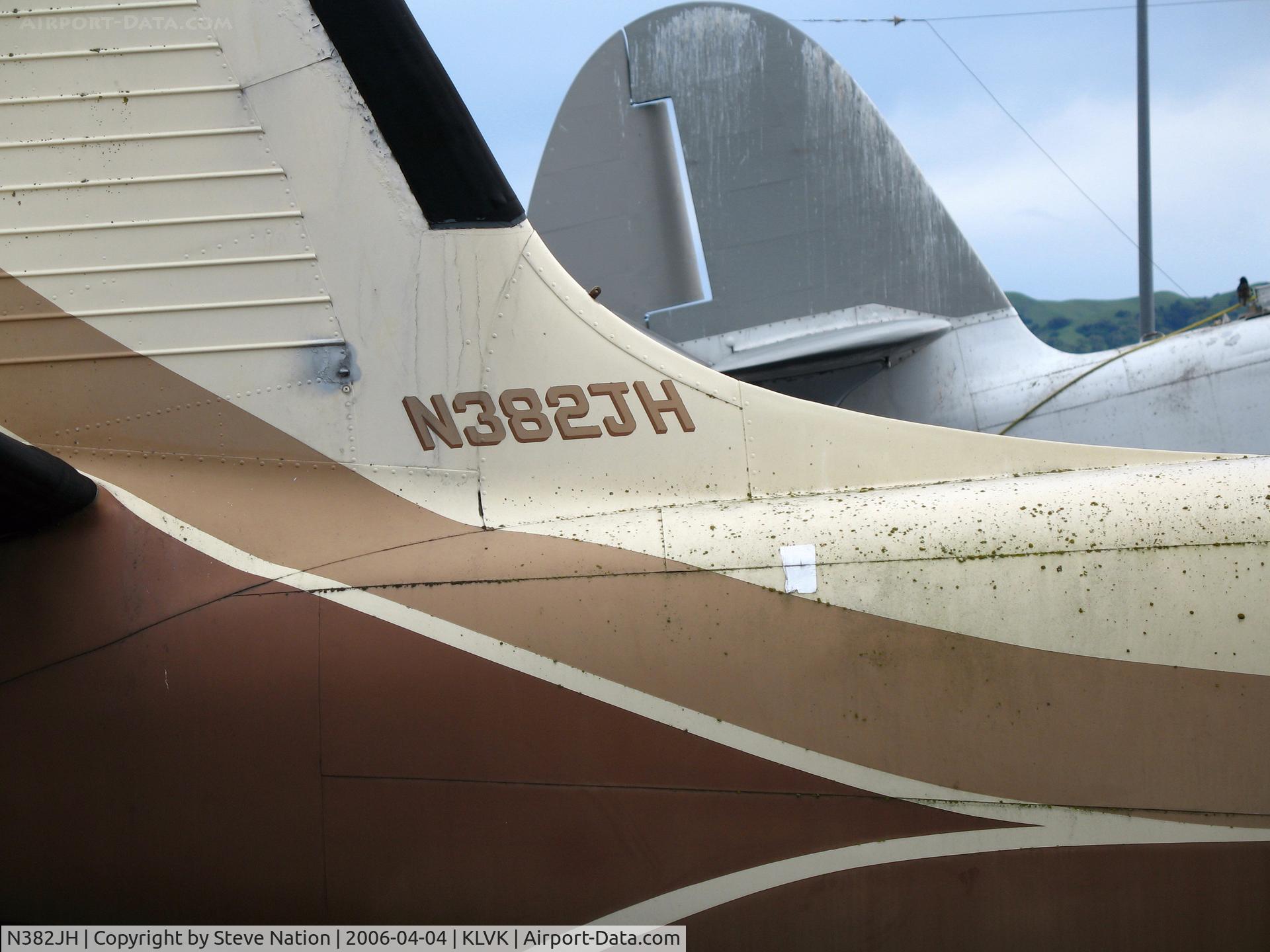 N382JH, 1955 Aero Commander 560-A C/N 55-4635, Close-up showing registration on 1955 Aero Commander 560-A @ Livermore, CA after the rain