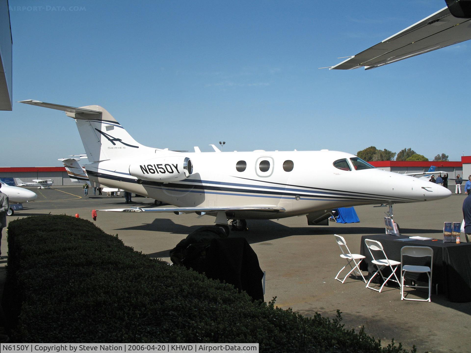 N6150Y, 2006 Raytheon Aircraft Company 390 C/N RB-150, Factory fresh Raytheon 390 demo amid the salesperson clutter @ Hayward, CA