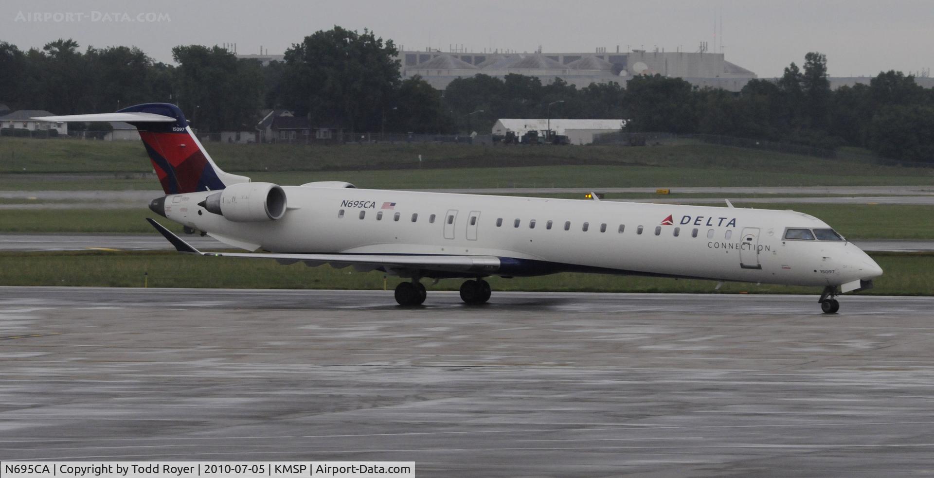 N695CA, 2006 Bombardier CRJ-900ER (CL-600-2D24) C/N 15097, Stormy day in MSP