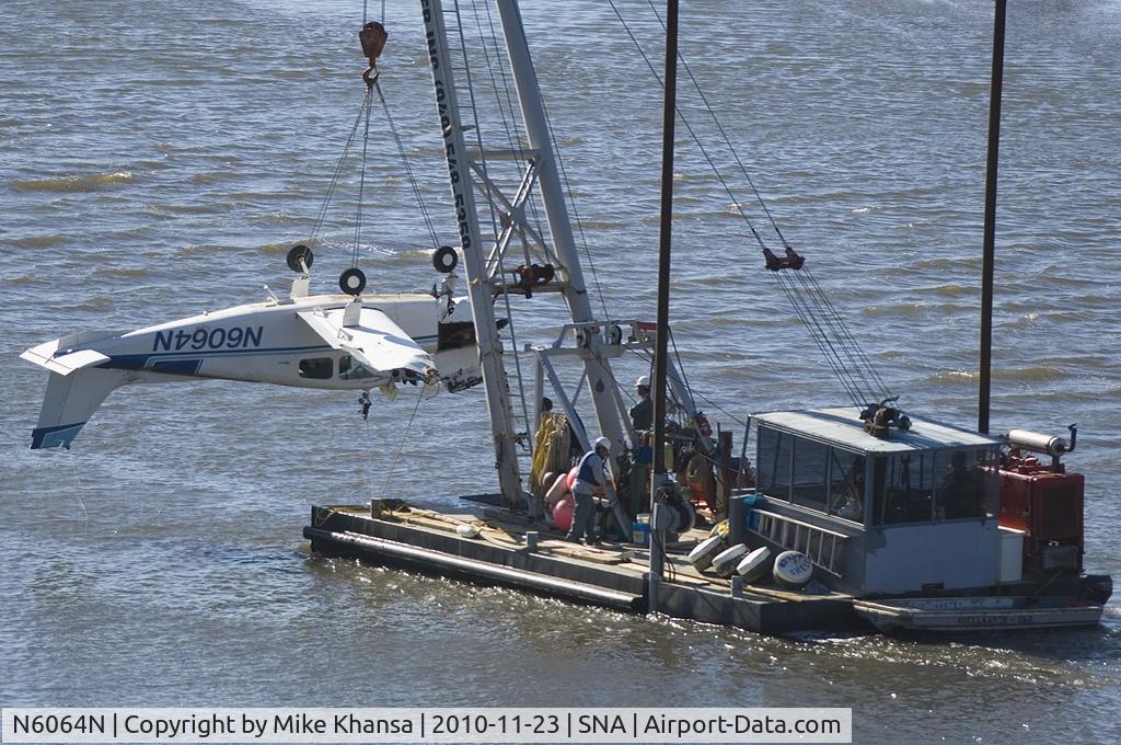 N6064N, 1968 Beech 19A C/N MB-388, Beach 19A being hauled away from where it crashed in shallow water just short of SNA airport killing all 3 persons on board!