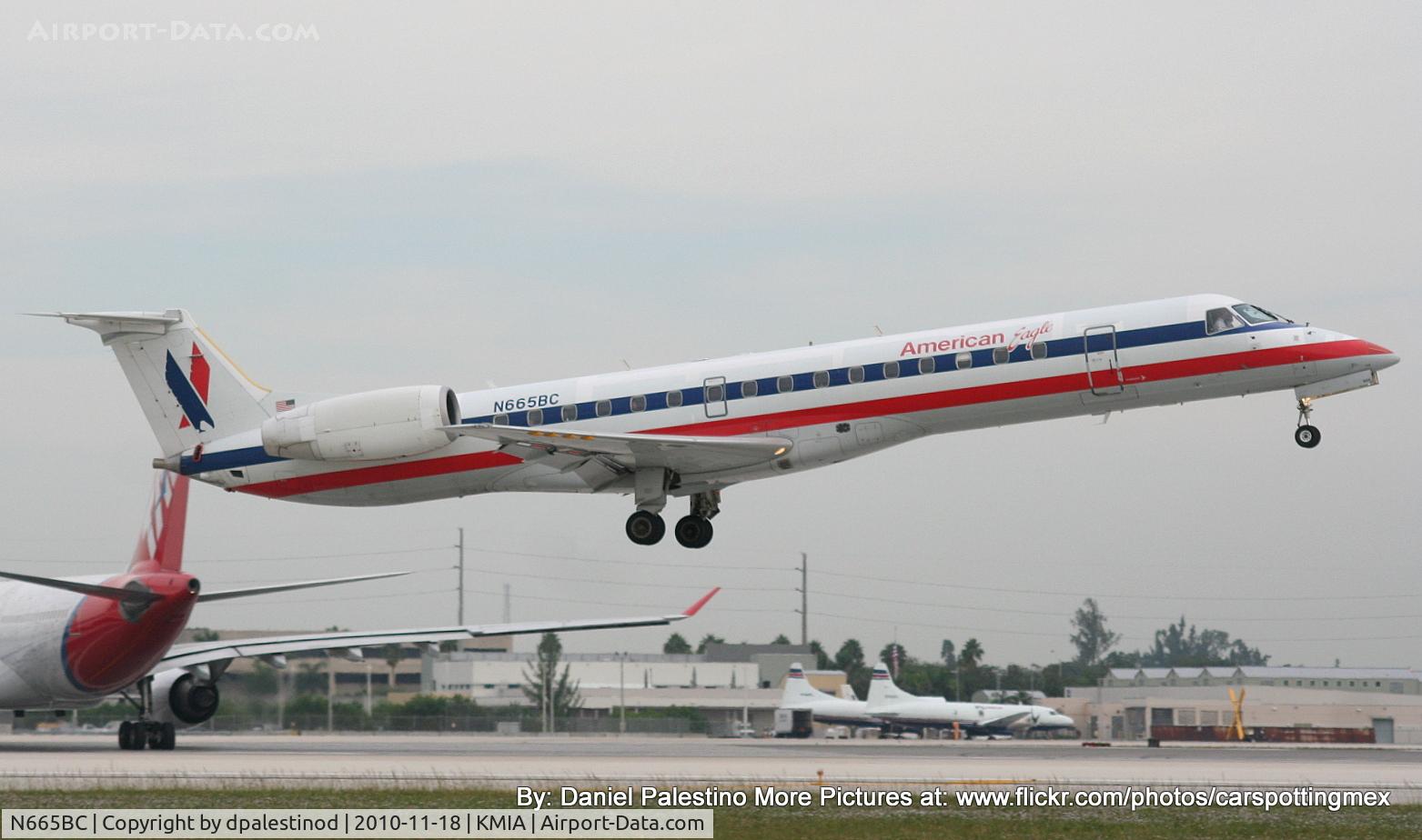 N665BC, 2004 Embraer ERJ-145LR (EMB-145LR) C/N 145783, Landing on RWY 12 at Miami!