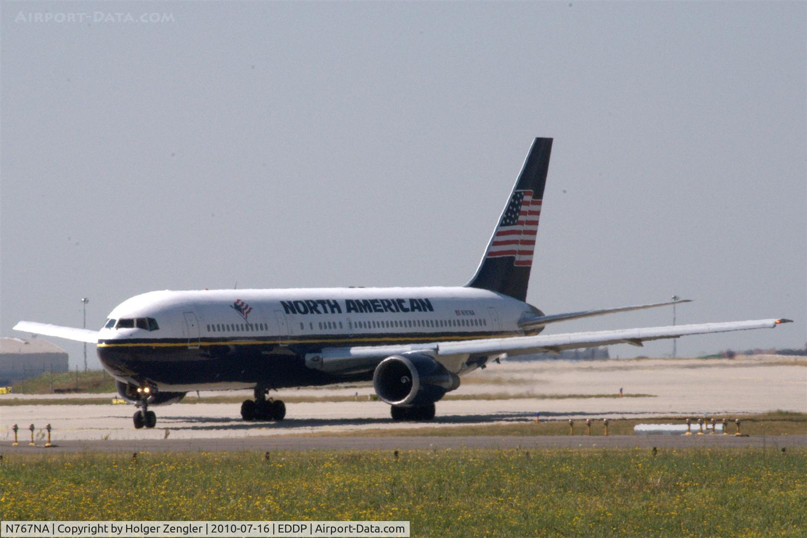 N767NA, 1996 Boeing 767-324 C/N 27569, Rolling down western taxiway for a take off on pretty hot rwy 08L.