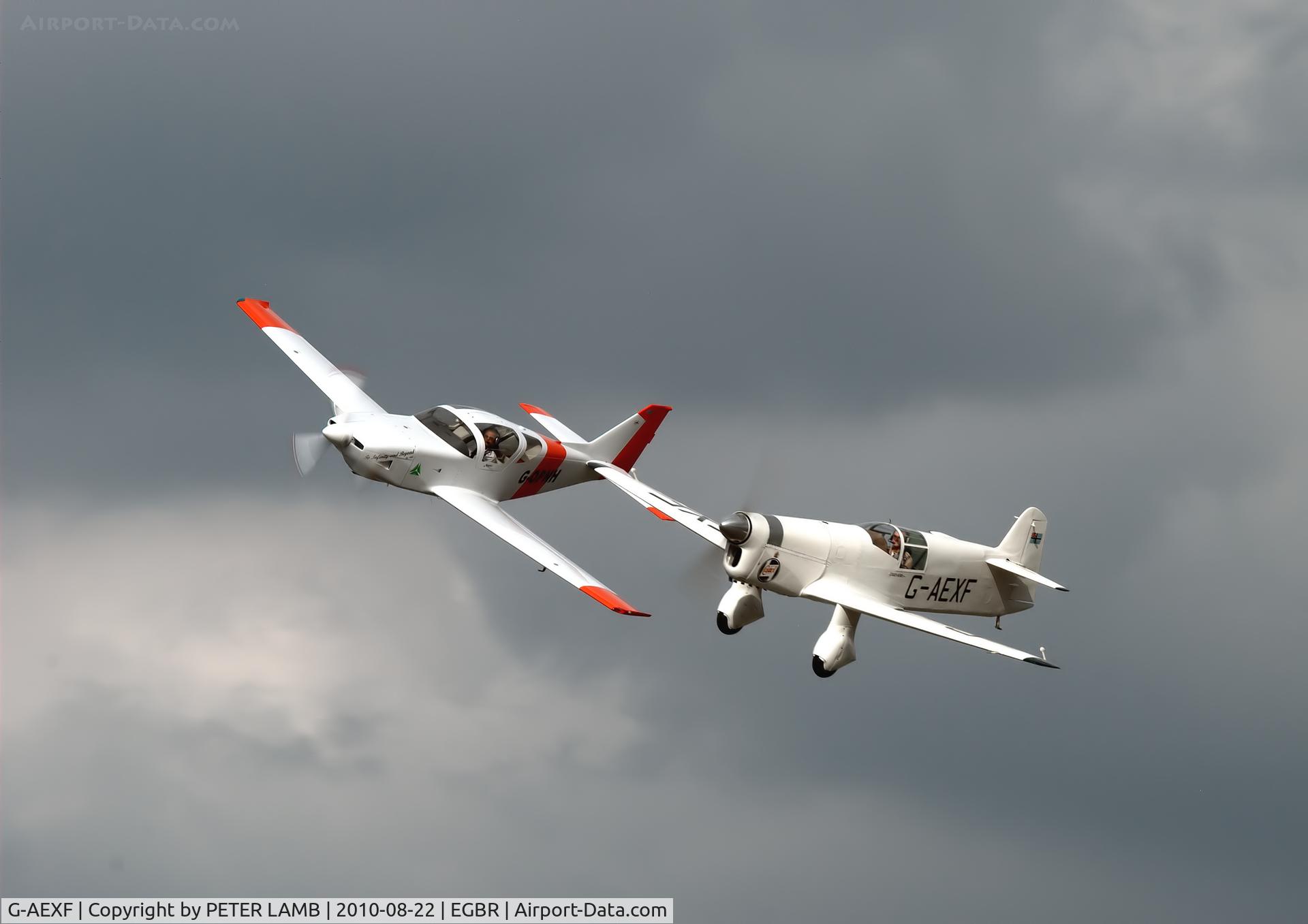 G-AEXF, 1936 Percival E-2H Mew Gull C/N E22, Mew Gull flying alongside Taff Smiths Glassair over Breighton Airfield