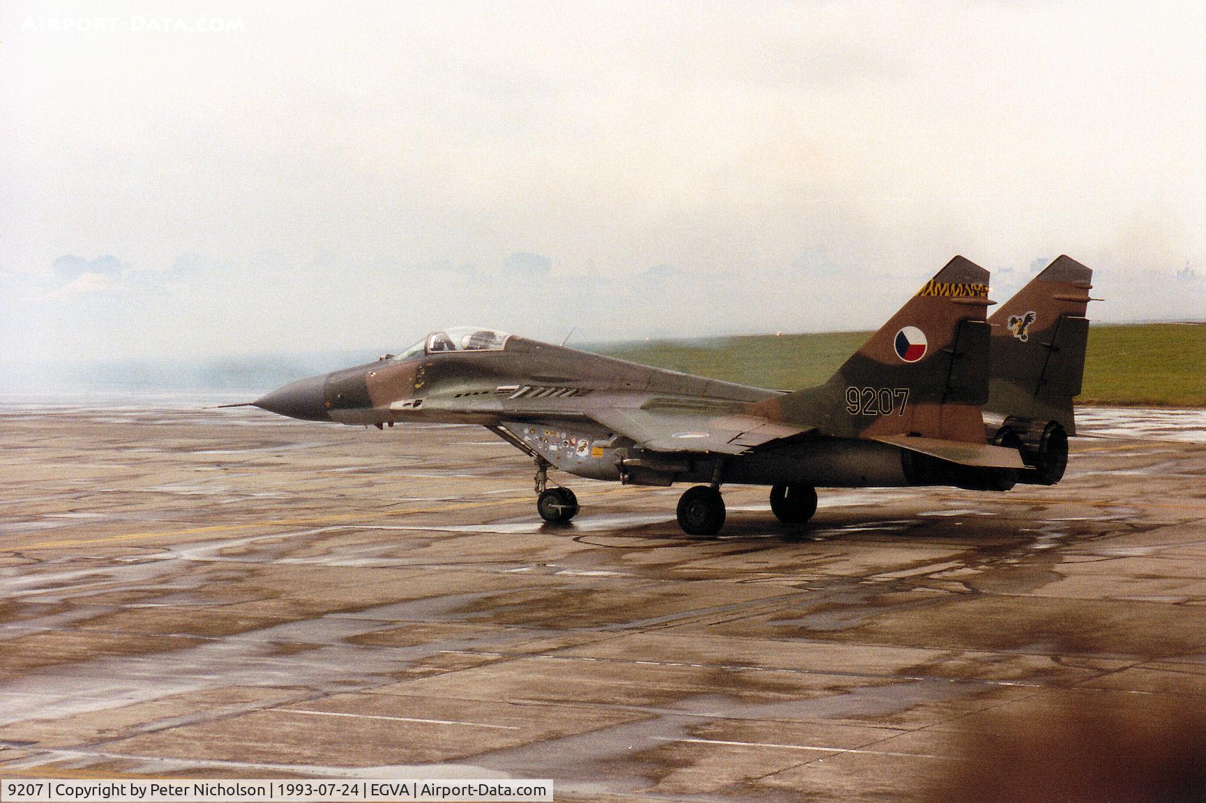 9207, Mikoyan-Gurevich MiG-29A C/N 26392, Czech Air Force MiG-29A Fulcrum preparing to join the active runway at the 1993 Intnl Air Tattoo at RAF Fairford. The visible spray will remind all those who were there of the weather conditions.