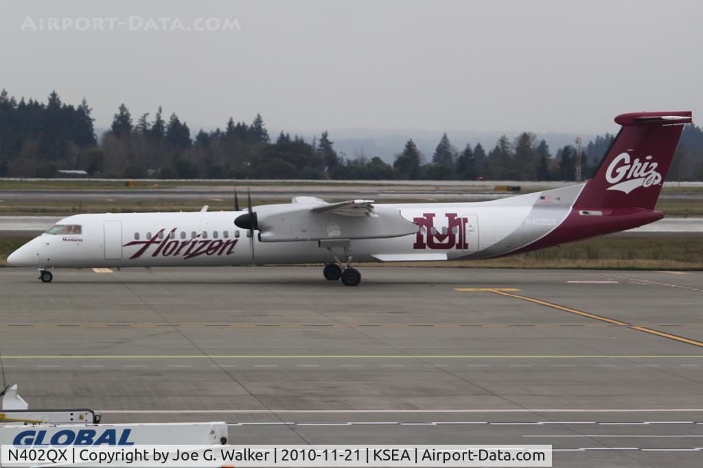 N402QX, 2001 Bombardier DHC-8-402 Dash 8 C/N 4032, Seen in the colors of the University of Montana Grizzlies, is this Horizon Air Q400.