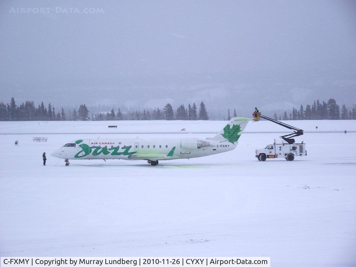 C-FXMY, 1996 Canadair CRJ-200ER (CL-600-2B19) C/N 7124, On the ramp at YXY, being de-iced for the return flight to YVR