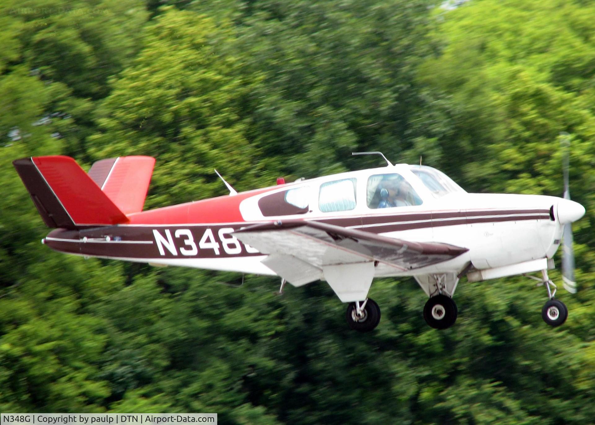 N348G, 1956 Beech G35 Bonanza C/N D-4532, Touching down on 14 at Downtown Shreveport.