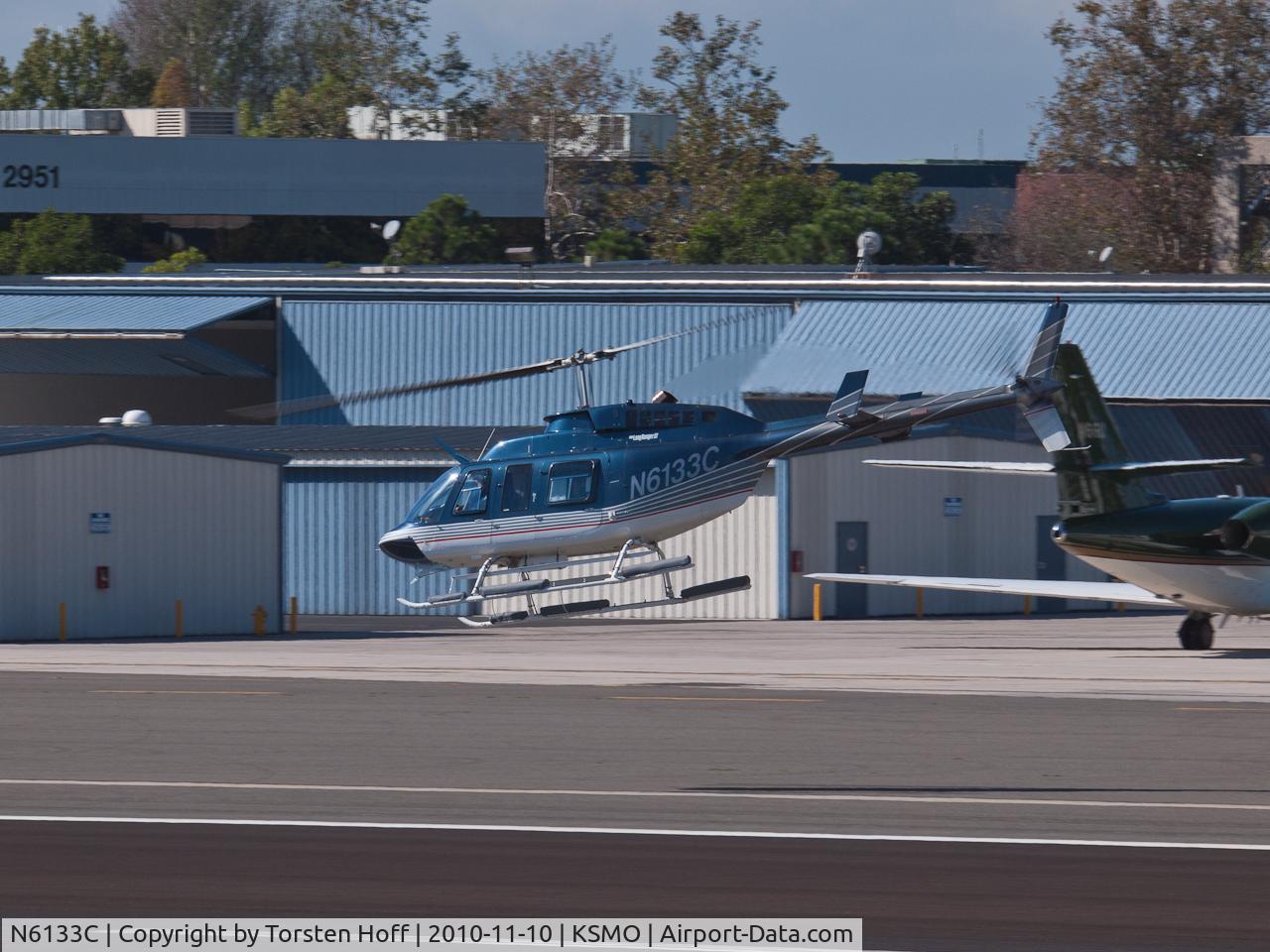 N6133C, 1991 Bell 206L-3 LongRanger III C/N 51544, N6133C departing from RWY 21