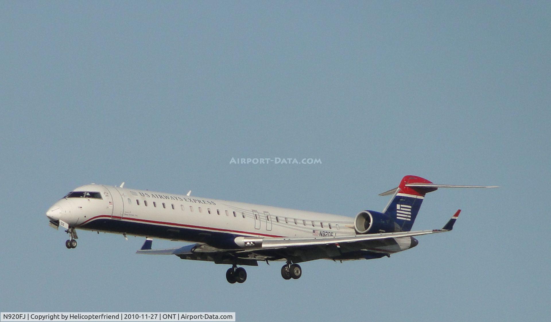 N920FJ, 2004 Bombardier CRJ-900ER (CL-600-2D24) C/N 15020, On final approach to runway 26R