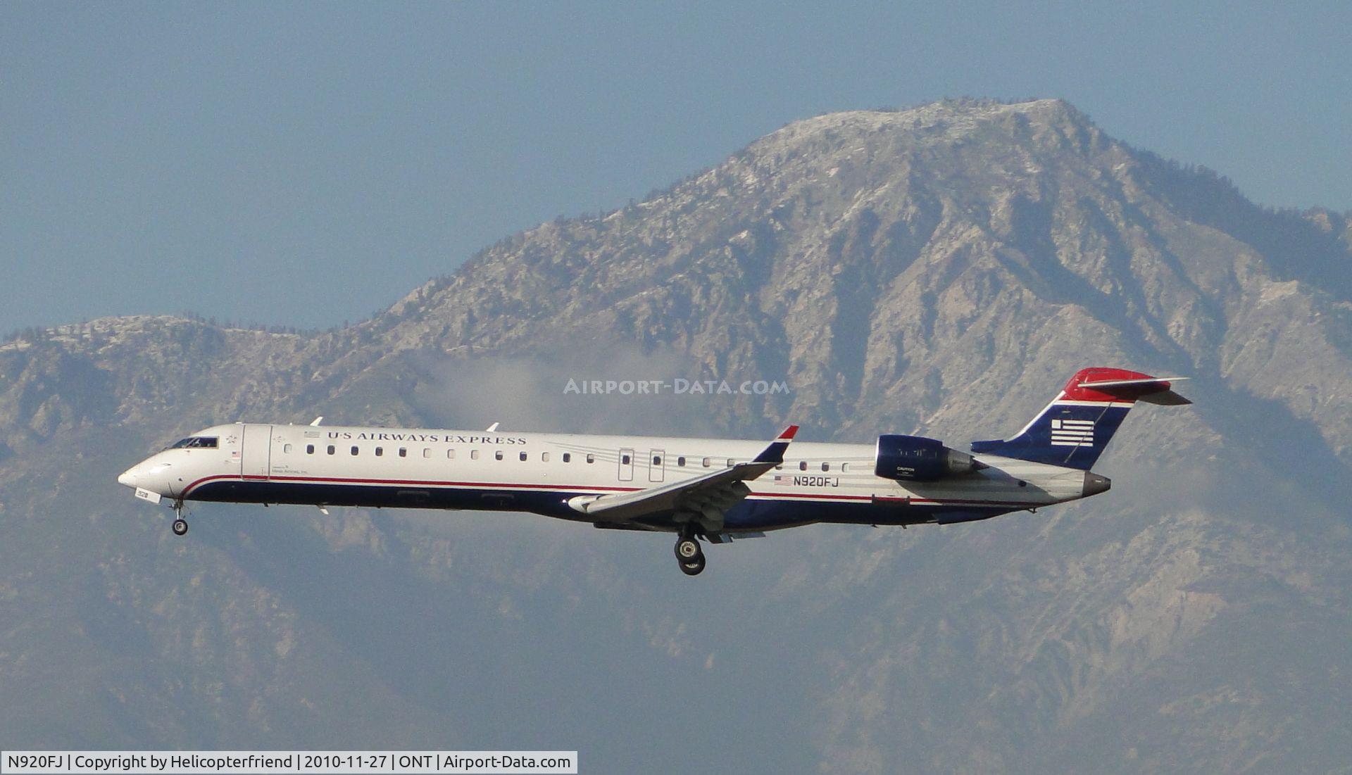 N920FJ, 2004 Bombardier CRJ-900ER (CL-600-2D24) C/N 15020, Approaching outer fence to runway 26R