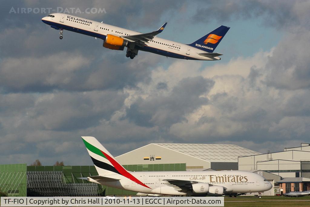 TF-FIO, 1999 Boeing 757-208 C/N 29436, Icelandair B757 departing from RW23R as Emirates A380 taxis to its stand