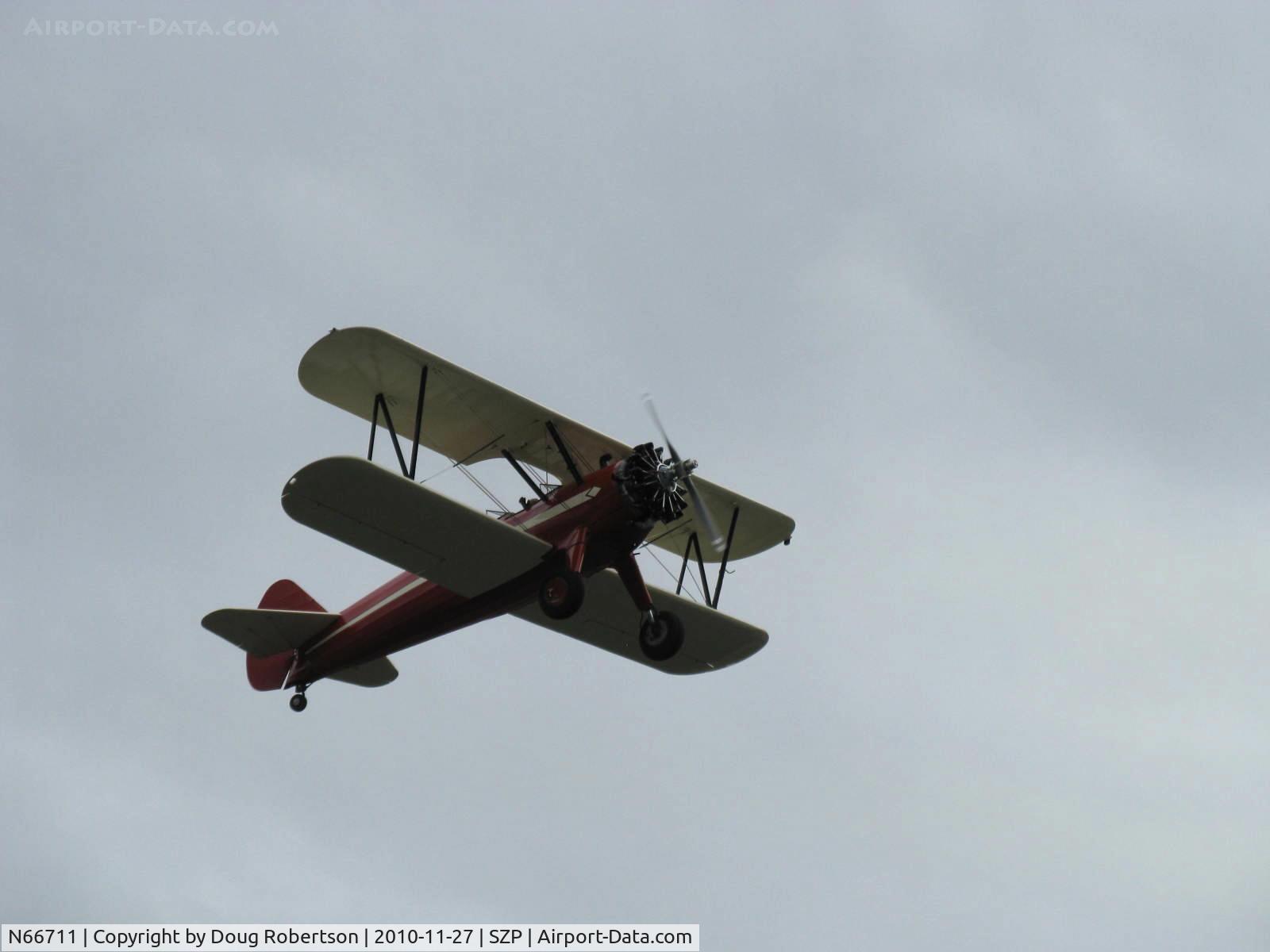 N66711, 1941 Boeing IB75A C/N 75-1675, 1941 Boeing Stearman IB75A, Jacobs R-755 B2 275 Hp upgrade, Experimental class total stunning restoration, takeoff climb Rwy 22