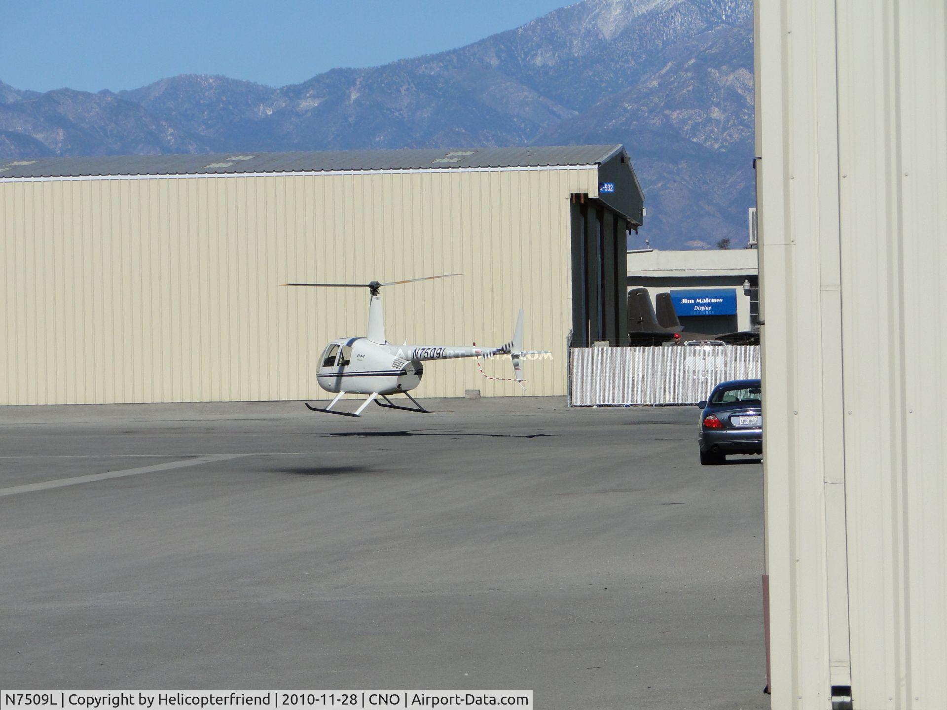 N7509L, 2001 Robinson R44 C/N 1145, Air taxiing to end of hanger row and requesting permission to take off westbound