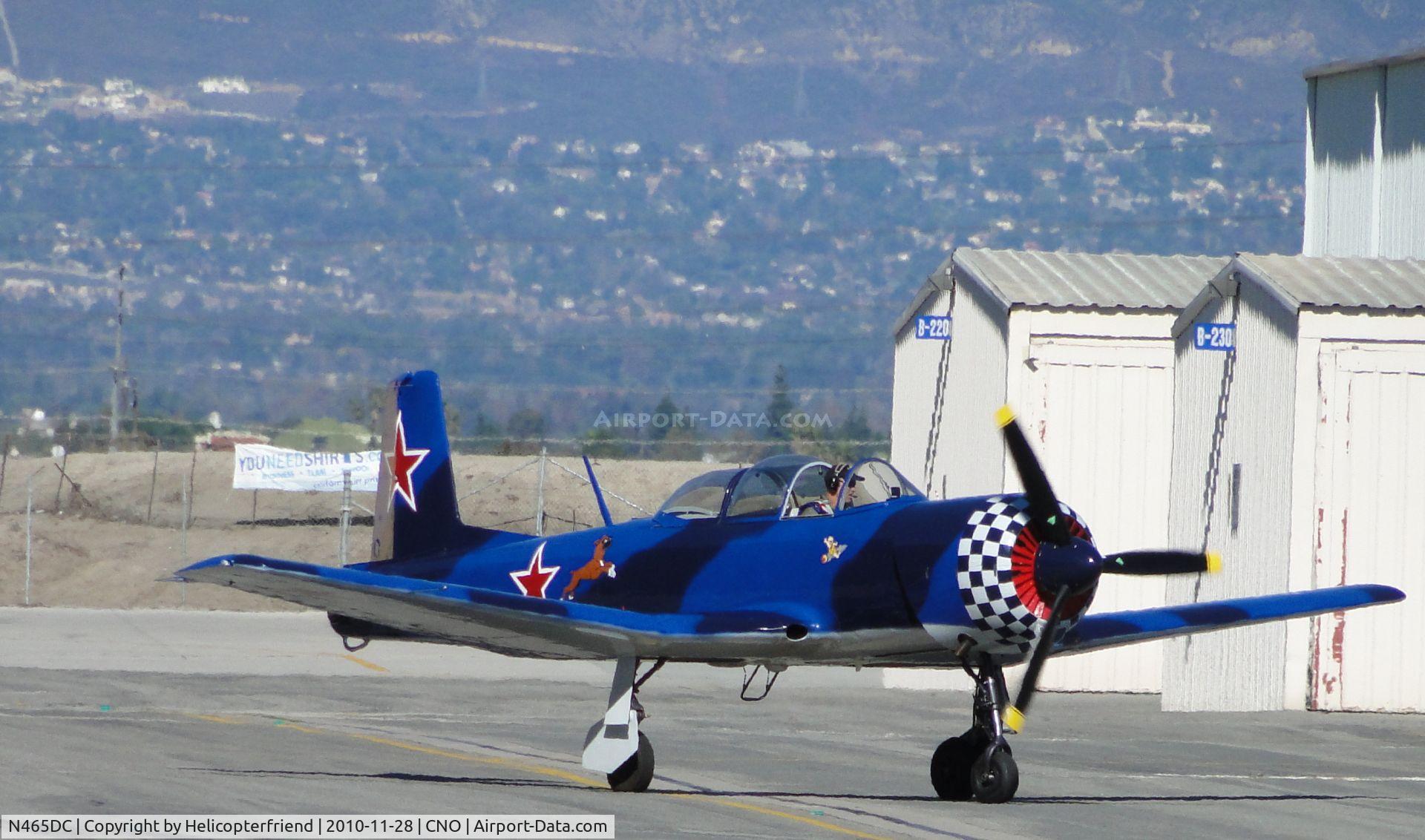 N465DC, Nanchang CJ-6 C/N 3632017, Taxiing between the hangers heading to runway 26L