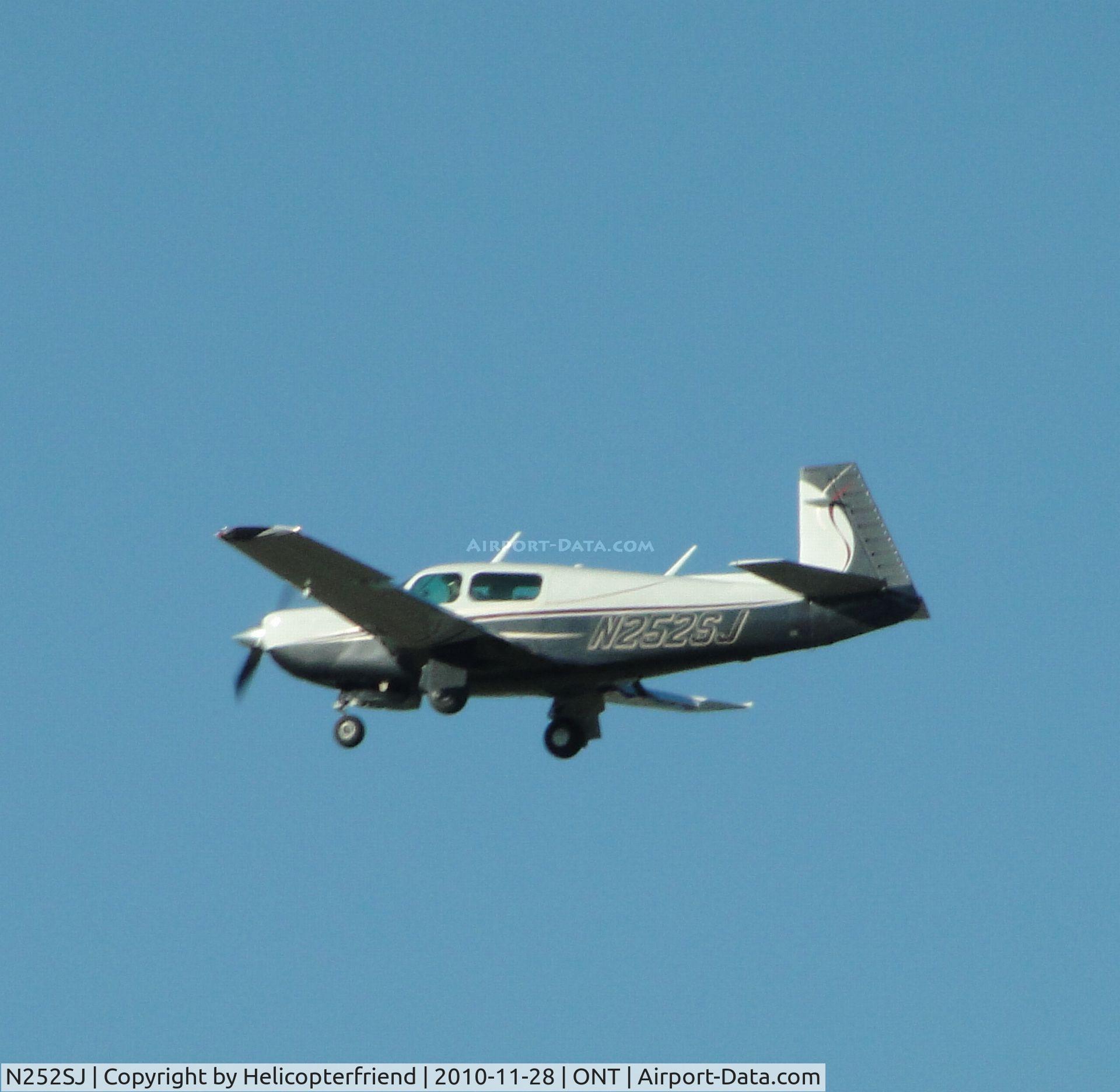 N252SJ, 1986 Mooney M20K C/N 25-1018, On final for runway 26R