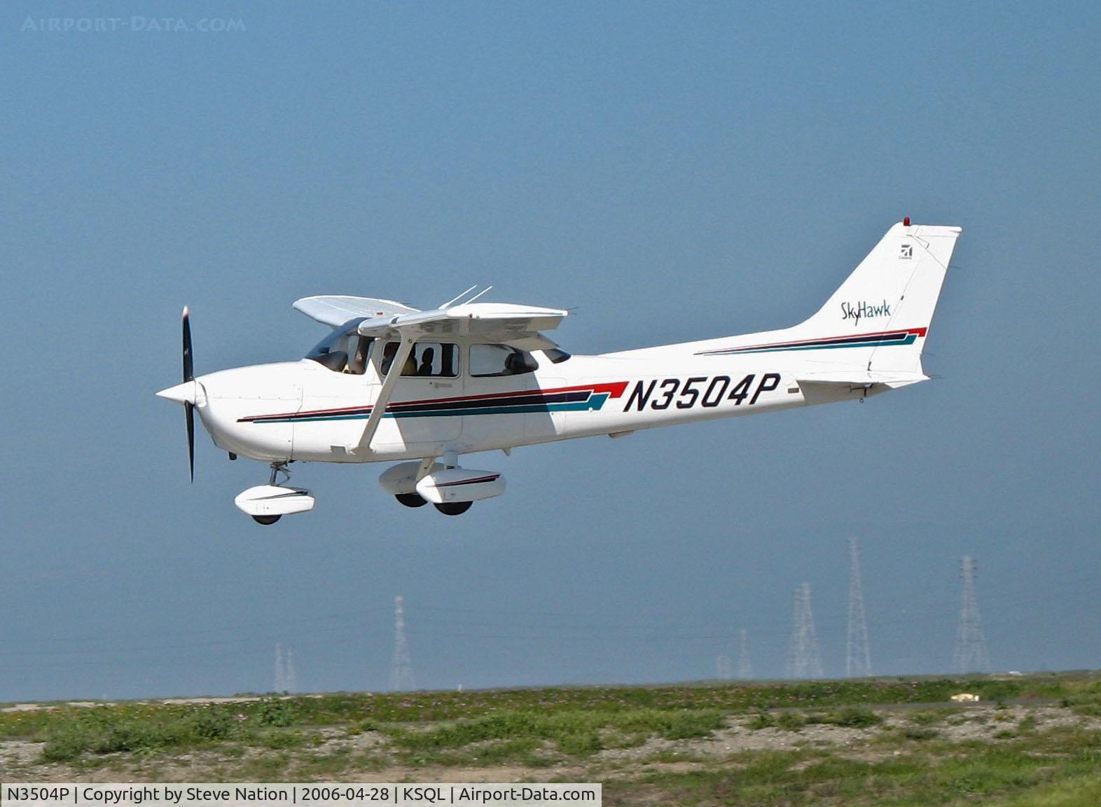 N3504P, 2001 Cessna 172R C/N 17281053, Locally-based 2001 Cessna 172R nears touchdown with power lines and SF Bay in background @ San Carlos, CA