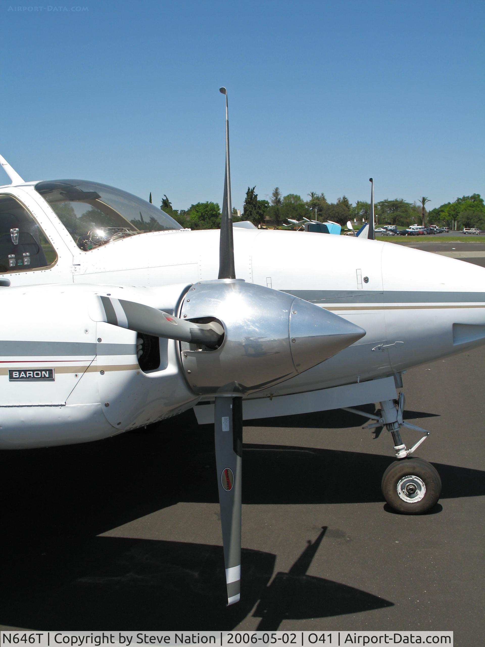 N646T, 1974 Beech E-55 Baron C/N TE-981, Close-up front view of 1974 Beech E-55 with Colemill Enterprises Foxstar conversion 4-blade Q tip props @ Woodland Aviation (see http://www.colemill.com/Conversions/FoxstarBaron.php)