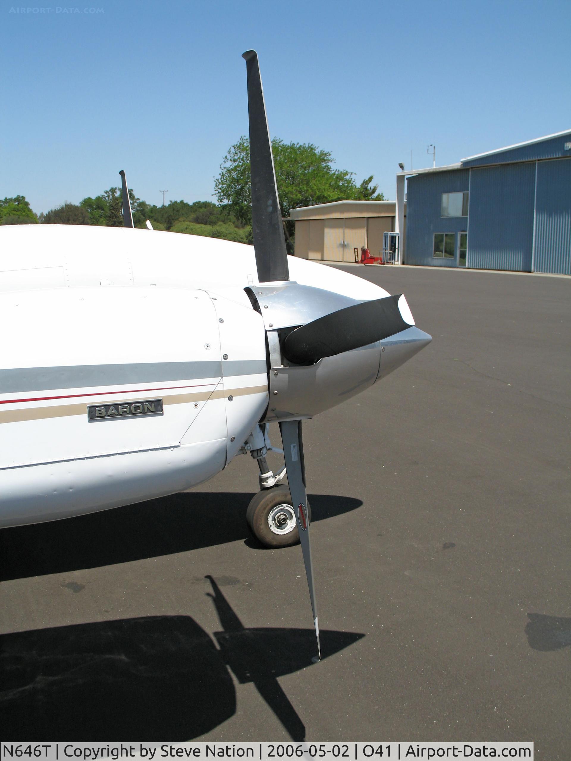 N646T, 1974 Beech E-55 Baron C/N TE-981, Close-up rear view of 1974 Beech E-55 with Colemill Enterprises Foxstar conversion 4-blade Q tip props @ Woodland Aviation (see http://www.colemill.com/Conversions/FoxstarBaron.php)