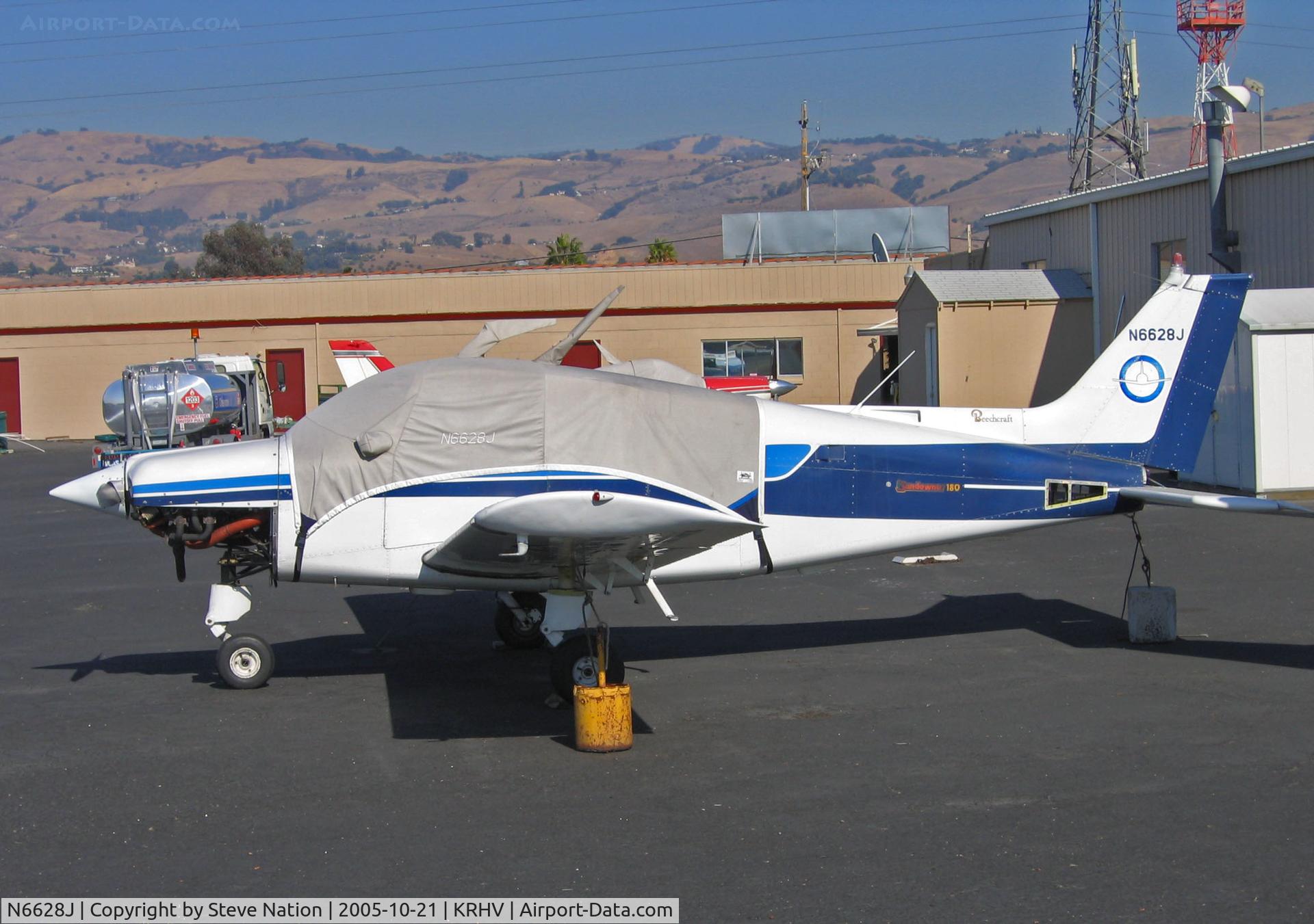 N6628J, 1979 Beech C23 Sundowner 180 C/N M-2182, Locally-based 1979 Beech C23 with cockpit covered and bottom cowlin panel removed in bright sunshine @ Reid-Hillview Airport, San Jose, CA
