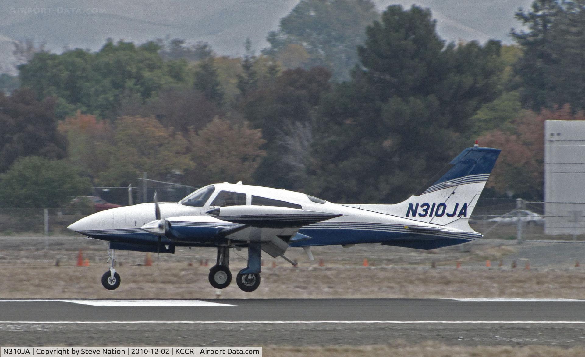 N310JA, 1978 Cessna T310R C/N 310R1319, Johnson Ranch (Bigfork, MT) 1978 Cessna T310R on touchdown to RWY 32R (in from KGOO/Nevada County Air Park, Grass Valley, CA) @ Buchanan Field, Concord, CA