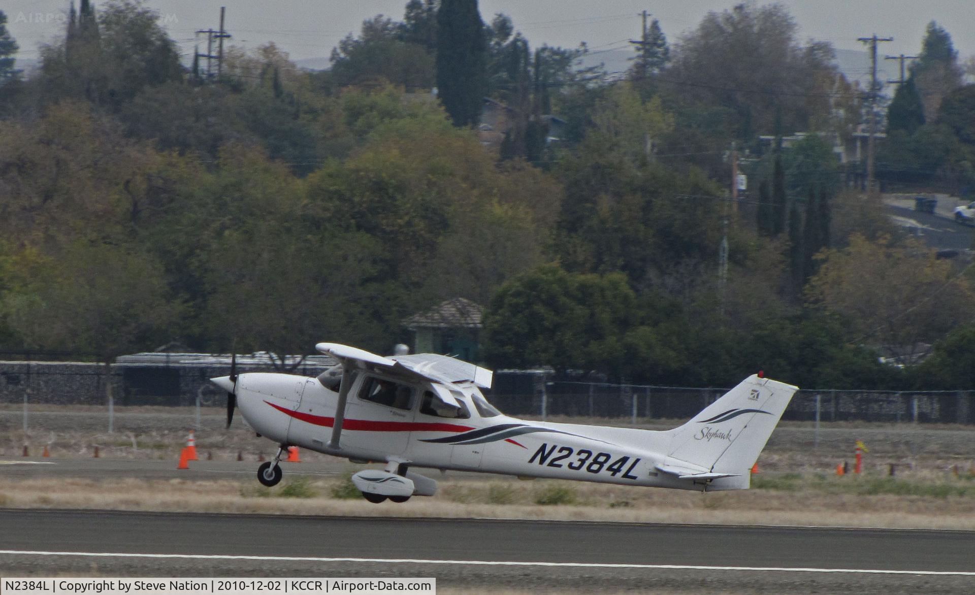 N2384L, 1999 Cessna 172R C/N 17280706, Locally-based 1999 Cessna 172R operated by Sterling Aviation touching down on RWY 32R @ Buchanan Field, Concord, CA
