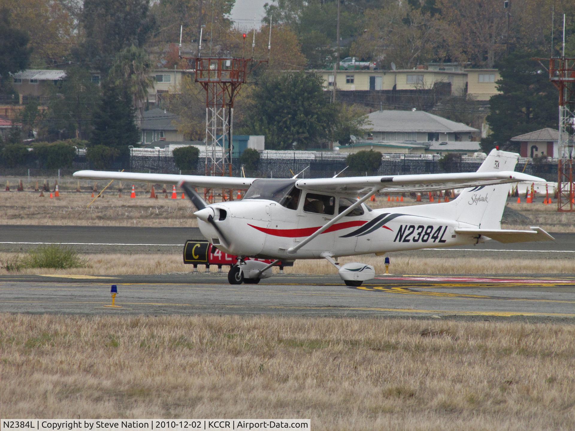 N2384L, 1999 Cessna 172R C/N 17280706, Locally-based 1999 Cessna 172R operated by Sterling Aviation taxis in (recognize where he is, Bill???) @ Buchanan Field, Concord, CA