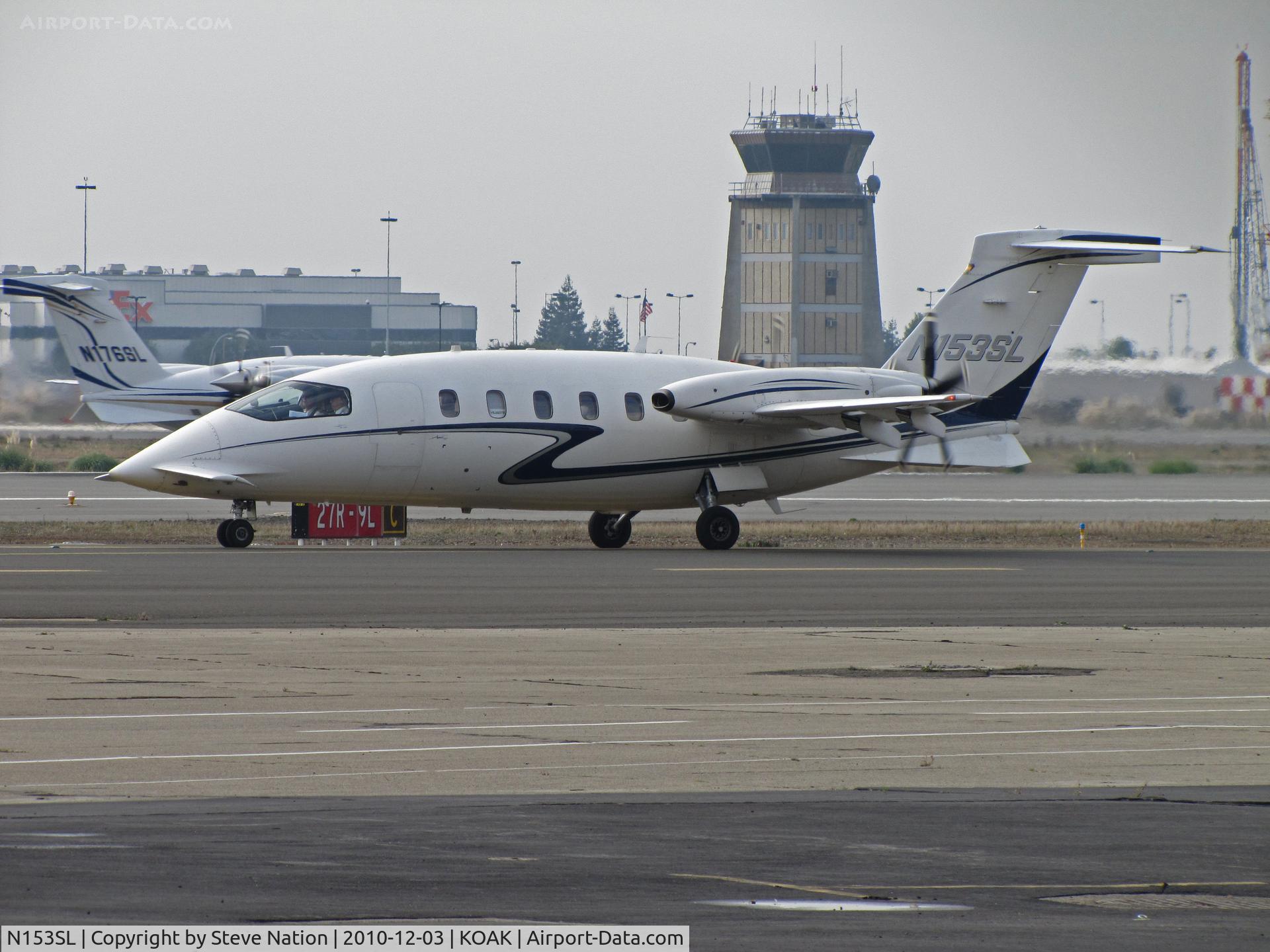 N153SL, 2002 Piaggio P-180 C/N 1054, Avantair 2002 Piagio P180 waiting for take-off on North Field runway with N176SL rolling @ Oakland International Airport, CA