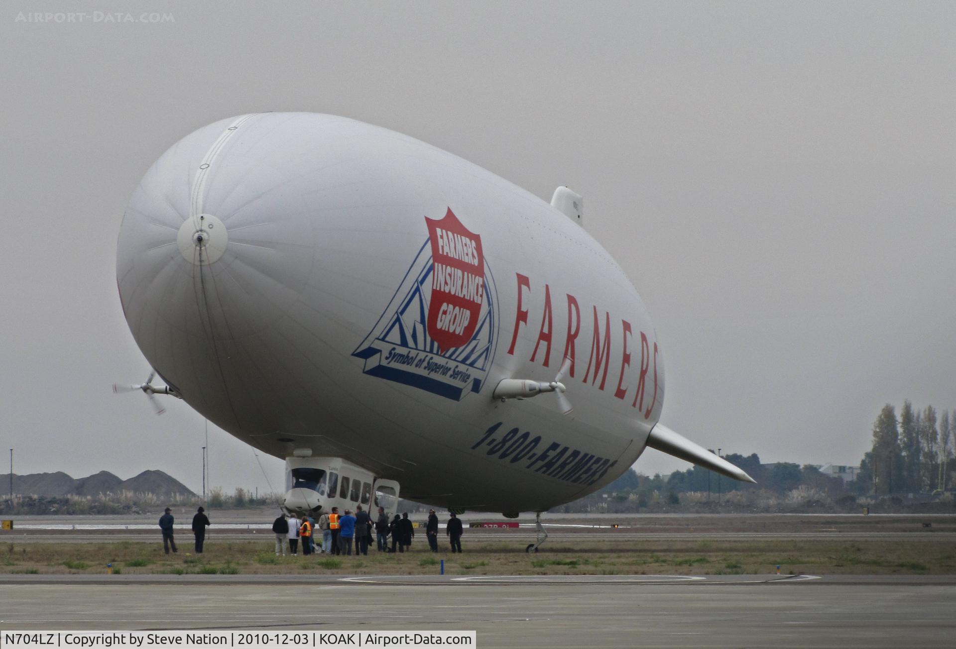 N704LZ, 2008 Zeppelin LZ N07-100 C/N 004, Airship Ventures dirigible in latest color scheme (Farmer's Insurance titles) ready for lift off from North Field ramp @ Oakland International Airport, CA