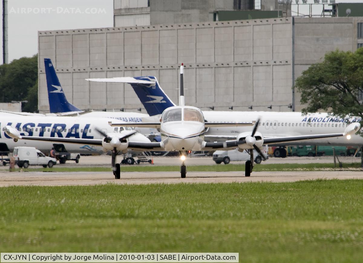 CX-JYN, Cessna 402B Businessliner C/N 402B1325, Taxi to executive ramp after land...